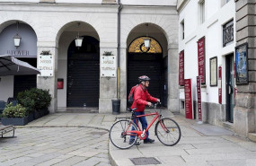ep february 25 2020 - milan italy a cyclist stops by the teatro alla scala to read a sign informing