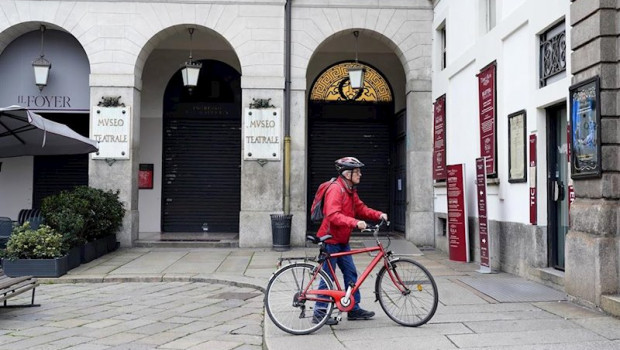 ep february 25 2020 - milan italy a cyclist stops by the teatro alla scala to read a sign informing