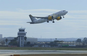 ep archivo   un avion despega y al fondo la torre de control en sevilla