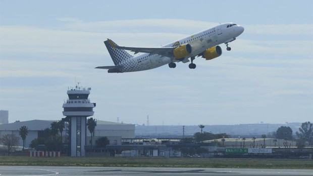 ep archivo   un avion despega y al fondo la torre de control en sevilla