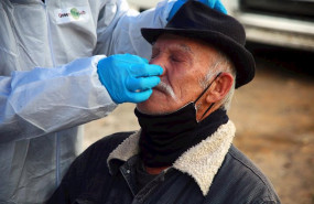 ep a health worker takes a sample from a man at a rapid corona test station following the chilean ep a health worker takes a sample from a man at a rapid corona test station following the chilean
