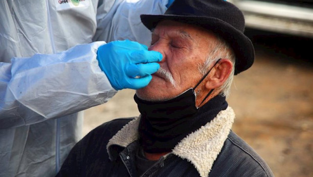 ep a health worker takes a sample from a man at a rapid corona test station following the chilean
