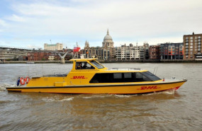 1601538436 dhl express riverboat on river with st pauls 1601538436 dhl express riverboat on river with st pauls