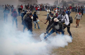 ep 11 october 2019 ecuador quito a protestor hurls a teargas canister during clashes between