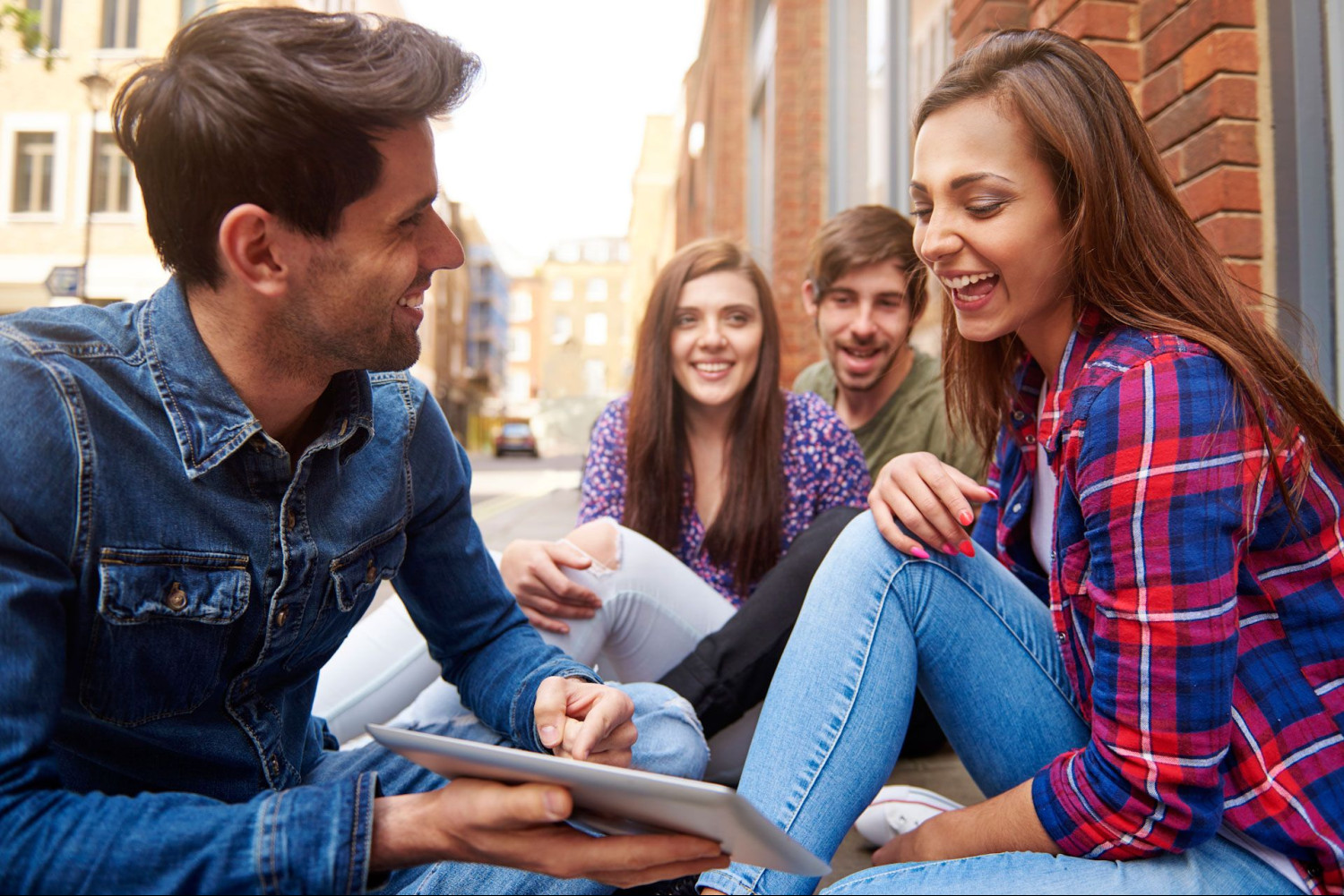 young people sitting pavement edited 