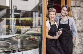 ep portrait of confident workers standing at supermarket entrance