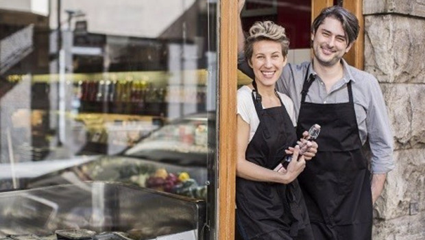ep portrait of confident workers standing at supermarket entrance