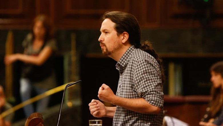 El secretario general de Unidas Podemos, Pablo Iglesias, interviene desde la tribuna del Congreso de los Diputados en la primera sesión del debate de investidura a la Presidencia del Gobierno. | Ricardo Rubio - Europa Press ep secretario generalunidas podemos pablo iglesias intervienela tribunacongresolos diputadosla primera sesiondebateinvestidurala presidenciagobierno