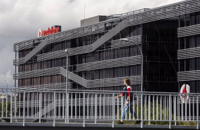 ep archivo   una persona camina al lado de la sede de vodafone en madrid el dia en el que la